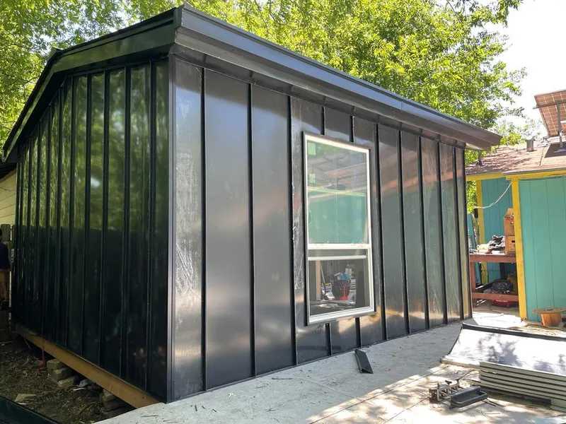 Black standing seam metal wall panels for Roof Inspection in Four Corners